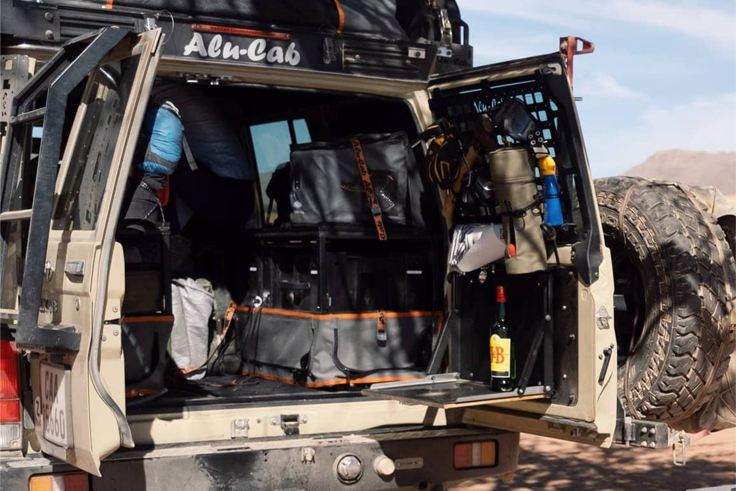 Alu-Cab Land Cruiser 76 Series Rear Door Molle Plates fitted to Toyota Land Cruiser 70 Series — Rival 4x4 Australia