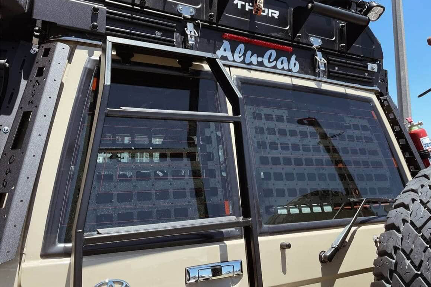 Alu-Cab Land Cruiser 76 Series Rear Door Molle Plates fitted to Toyota Land Cruiser 70 Series — Rival 4x4 Australia